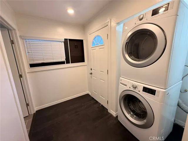 a kitchen with granite countertop a sink stove and cabinets
