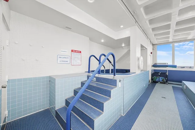 a view of living room with furniture and a rug