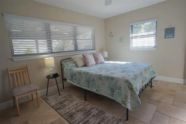 a kitchen with stainless steel appliances granite countertop a refrigerator a stove a sink and a cabinets