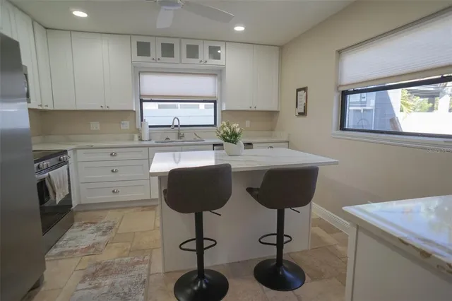 a kitchen with a sink stove and refrigerator