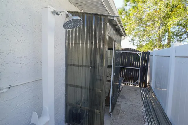 a view of the house with backyard and porch