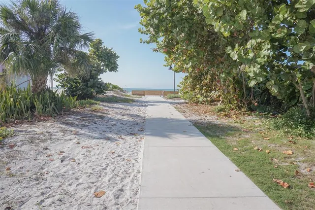 a front view of a house with a outdoor seating area