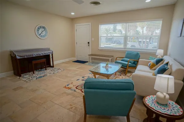 a living room with furniture and a couch
