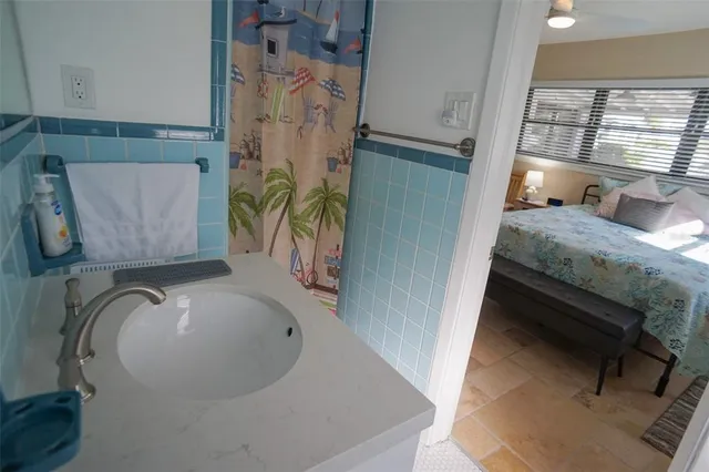 a bedroom with a bed and a table in it