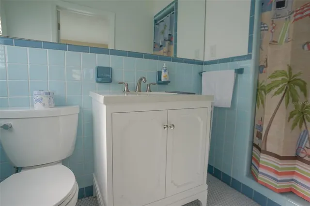 a sign board with yard in the back