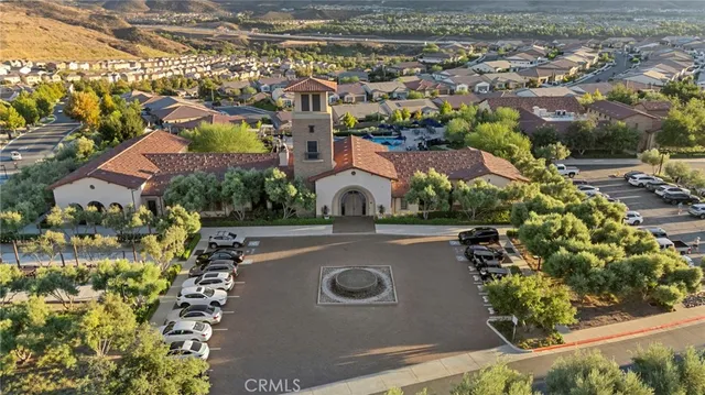 an aerial view of residential house with outdoor space and parking