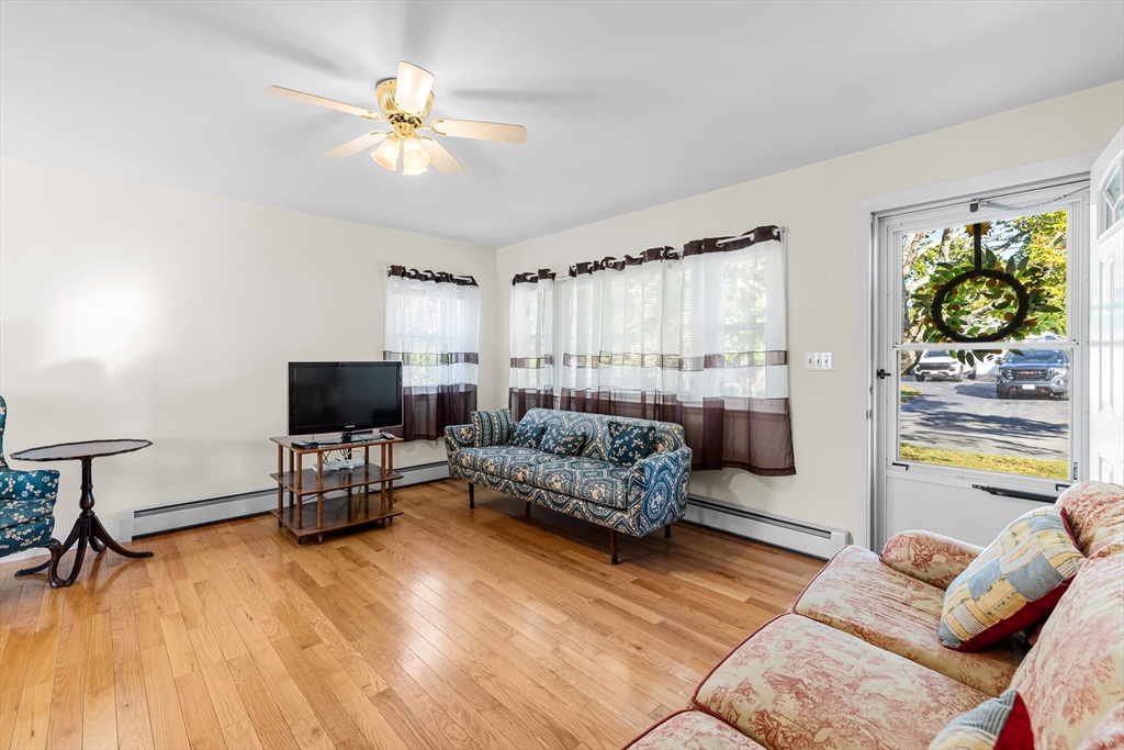 71 Harding Road Fairhaven, MA 02719 - Photo 12 of 28 a living room with furniture and a flat screen tv