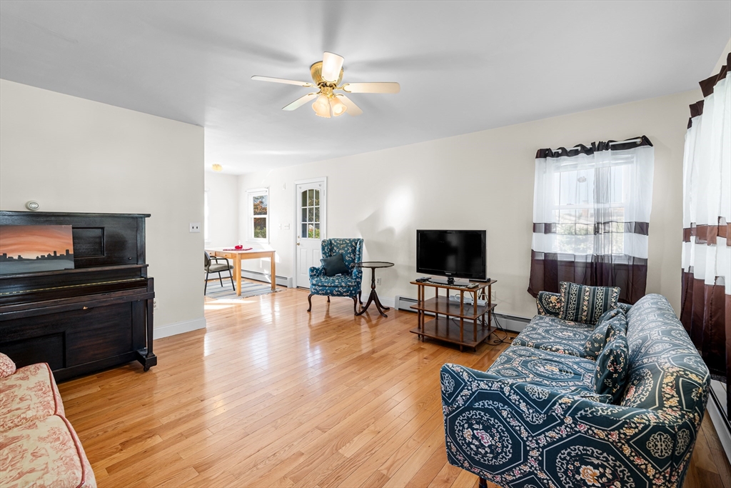 71 Harding Road Fairhaven, MA 02719 - Photo 13 of 28 a living room with furniture and a flat screen tv