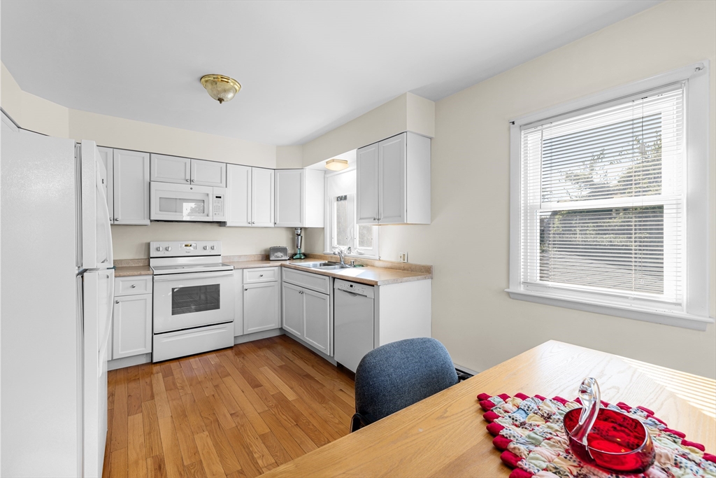 71 Harding Road Fairhaven, MA 02719 - Photo 17 of 28 a kitchen with granite countertop a sink cabinets stainless steel appliances and a window
