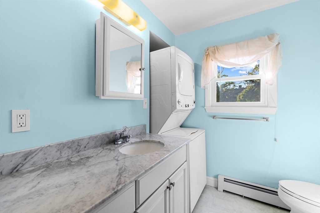71 Harding Road Fairhaven, MA 02719 - Photo 26 of 28 a bathroom with a sink and a mirror