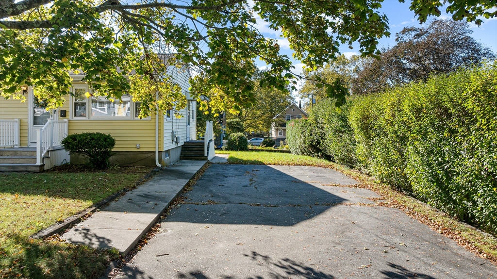 71 Harding Road Fairhaven, MA 02719 - Photo 10 of 28 a view of a yard with plants and large trees