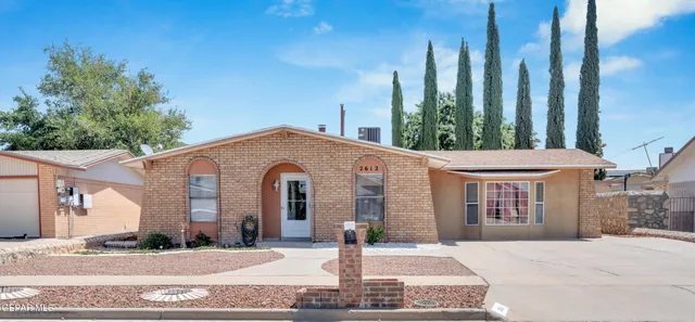 a front view of a building with garden