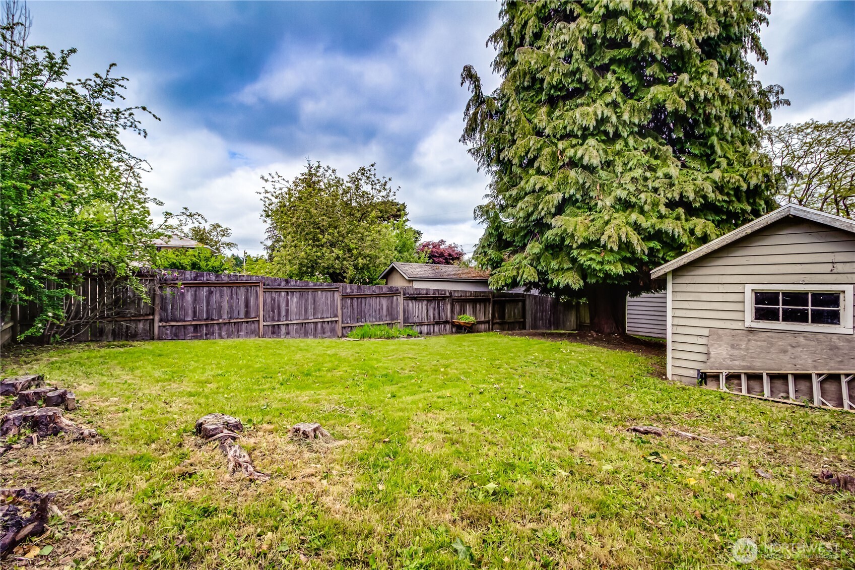 9817 35th Avenue Southwest Seattle, WA 98126 - Photo 14 of 25 a view of backyard with wooden fence