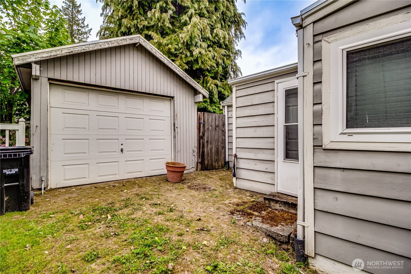 9817 35th Avenue Southwest Seattle, WA 98126 - Photo 17 of 25 a view of a house with a yard