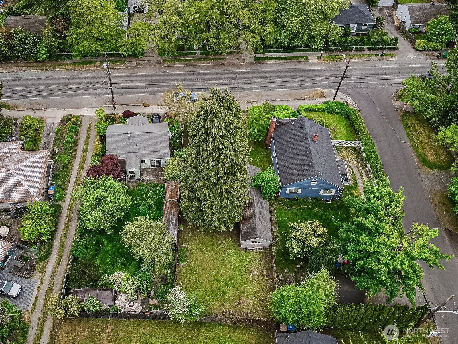 9817 35th Avenue Southwest Seattle, WA 98126 - Photo 19 of 25 an aerial view of a house with a yard