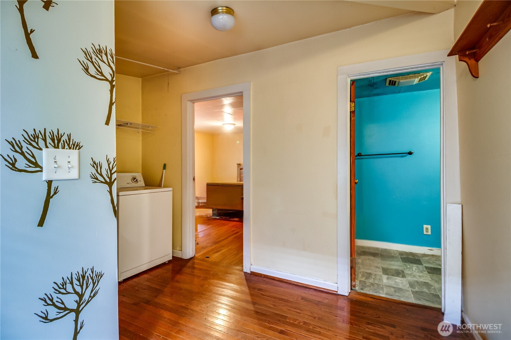 9817 35th Avenue Southwest Seattle, WA 98126 - Photo 7 of 25 a view of a hallway with wooden floor