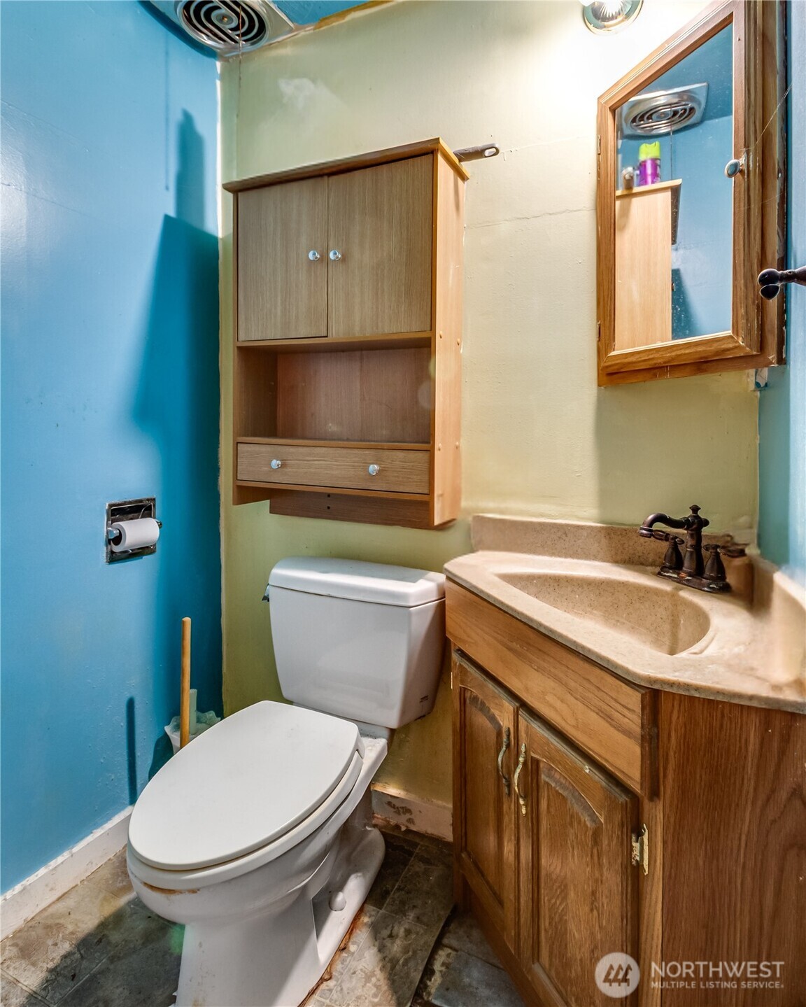 9817 35th Avenue Southwest Seattle, WA 98126 - Photo 8 of 25 a bathroom with a sink a toilet and mirror