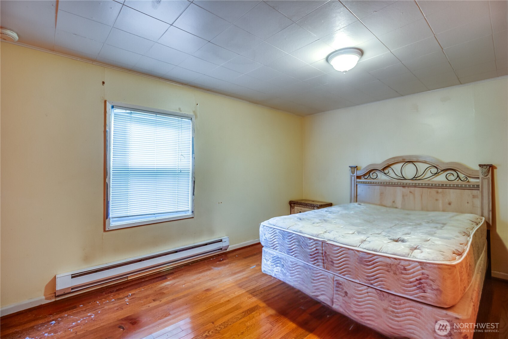 9817 35th Avenue Southwest Seattle, WA 98126 - Photo 10 of 25 a room with a wooden floor and a sink