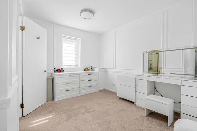 a room that has a dresser and a window