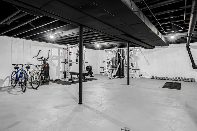 an aerial view of a house with swimming pool and ocean view