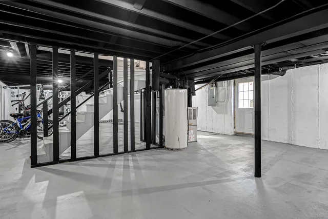 a view of a house with pool and a yard