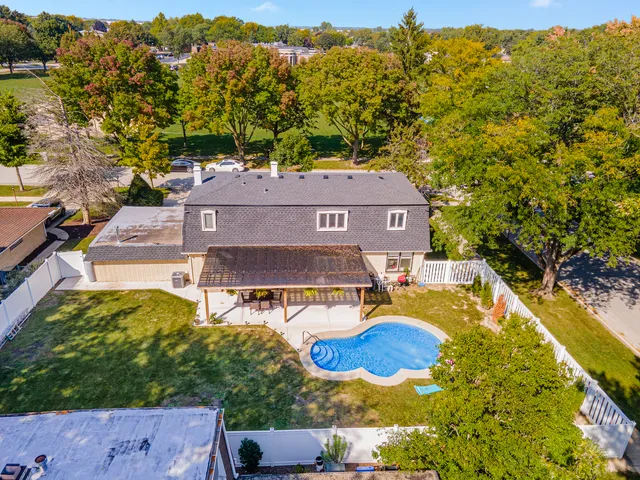 a view of a swimming pool with a patio