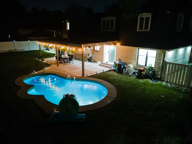 an aerial view of a house with a lake view