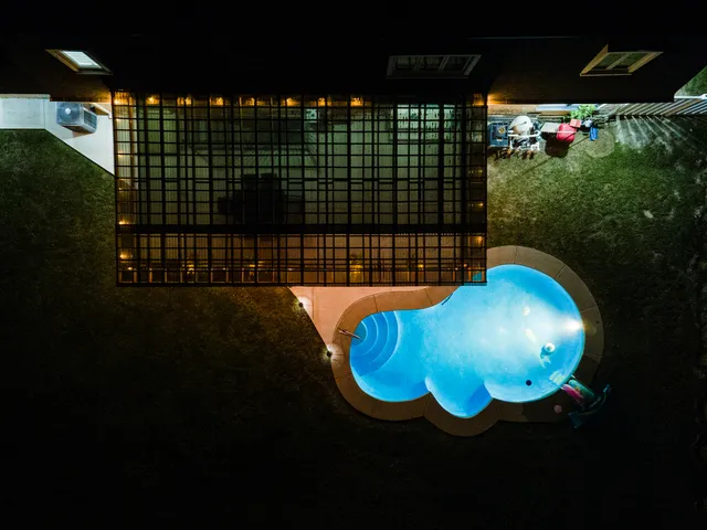 a view of swimming pool with outdoor seating and yard