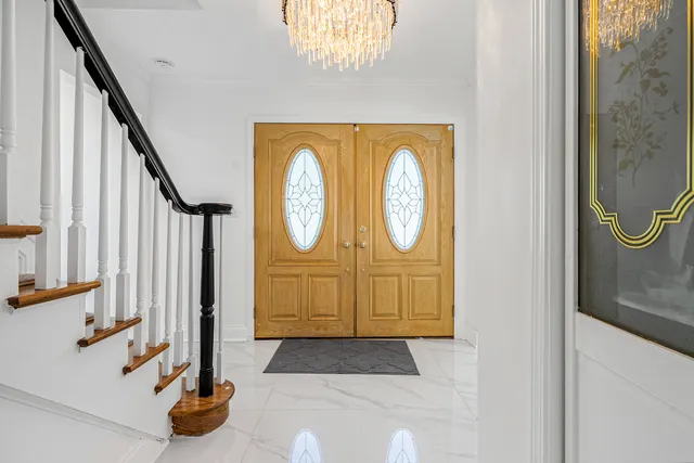 a view of a entryway door with wooden floor
