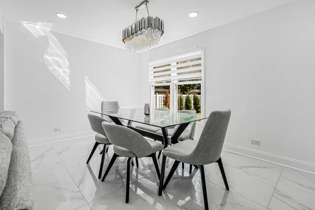 a view of a dining room with furniture and window