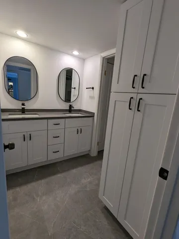 a bathroom with a sink and a mirror