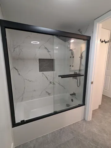 a white toilet sitting in a bathroom