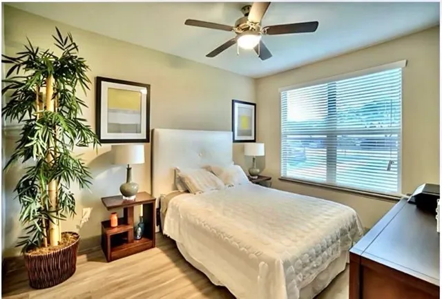 a bedroom with a bed and a window