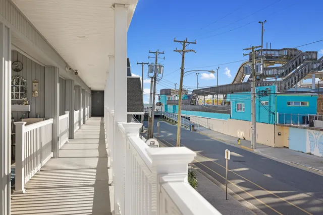 a view of a living room and kitchen