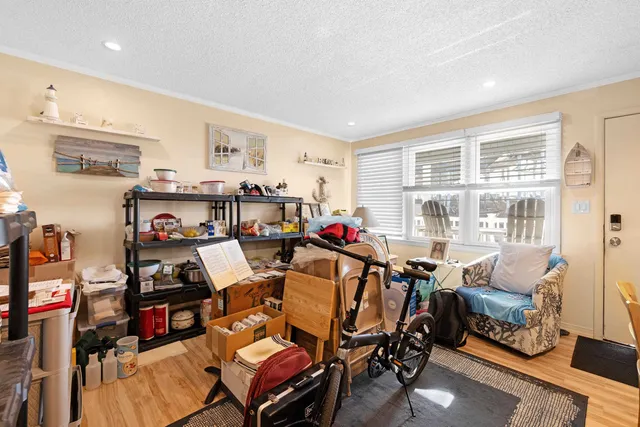a view of a livingroom with furniture and a flat screen tv