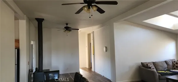 a view of room with wooden floor