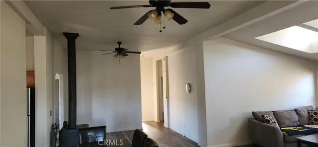 a kitchen with granite countertop a sink stove and cabinets
