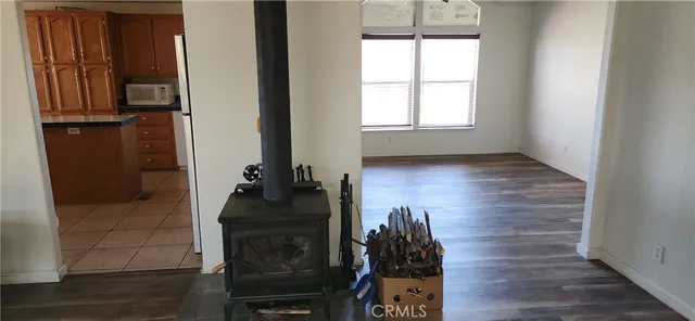 a living room with a bed and a window