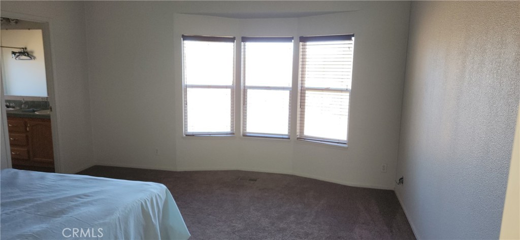 238 Elams Ranch Road Oroville, CA 95966 - Photo 27 of 75 a bed sitting in a bedroom next to a window