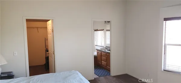 a room with a bed and a window