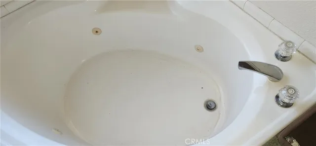 a view of a house with a yard covered with snow in the background