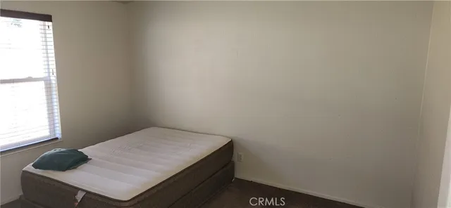 a wooden bench sitting in the middle of a yard