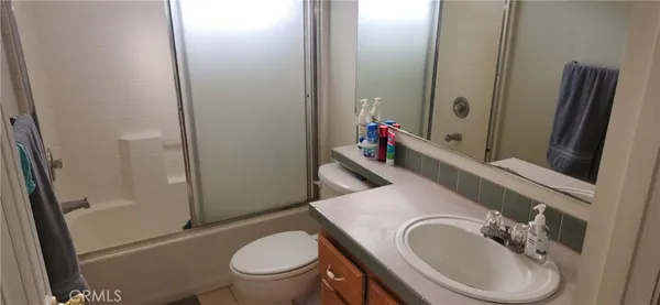 a view of a lake with a tree in the background