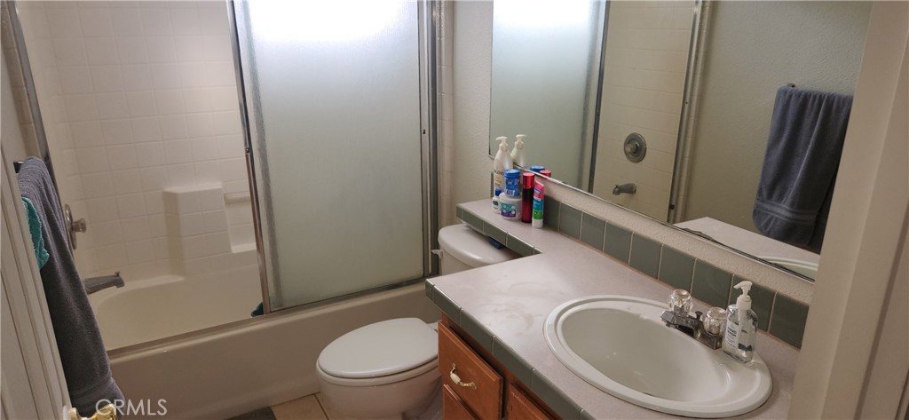 238 Elams Ranch Road Oroville, CA 95966 - Photo 41 of 75 a bathroom with a granite countertop toilet sink and mirror