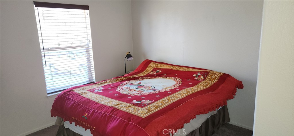 238 Elams Ranch Road Oroville, CA 95966 - Photo 44 of 75 a bed sitting in a bedroom next to a window