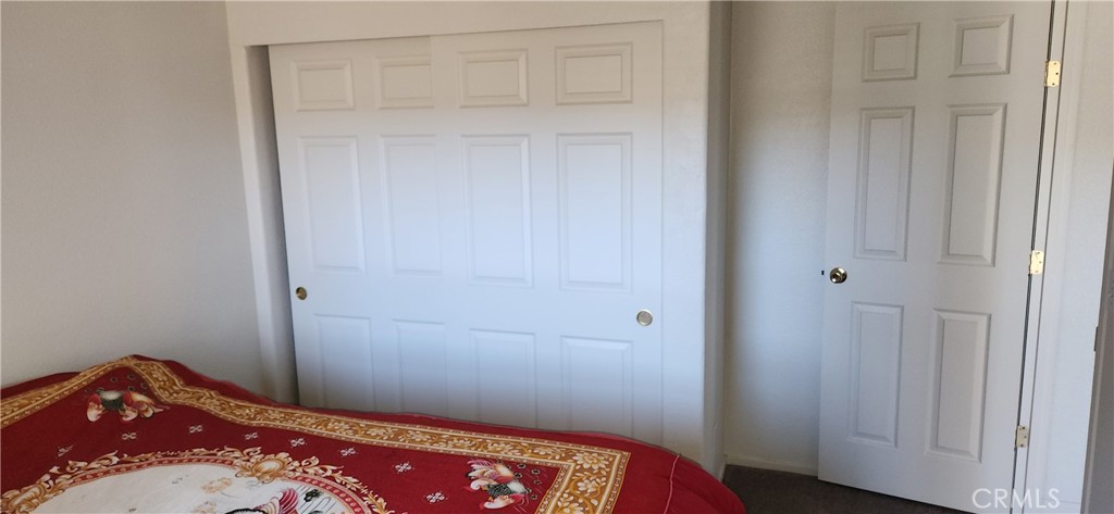 238 Elams Ranch Road Oroville, CA 95966 - Photo 46 of 75 a bedroom with a bed and wooden floor