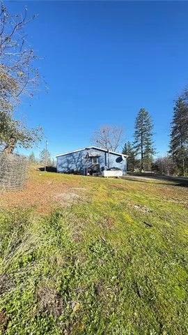 a view of yard with patio