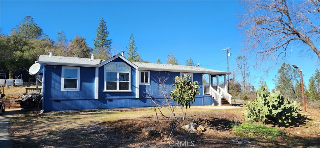 238 Elams Ranch Road Oroville, CA 95966 - Photo 7 of 75 a front view of a house with a yard