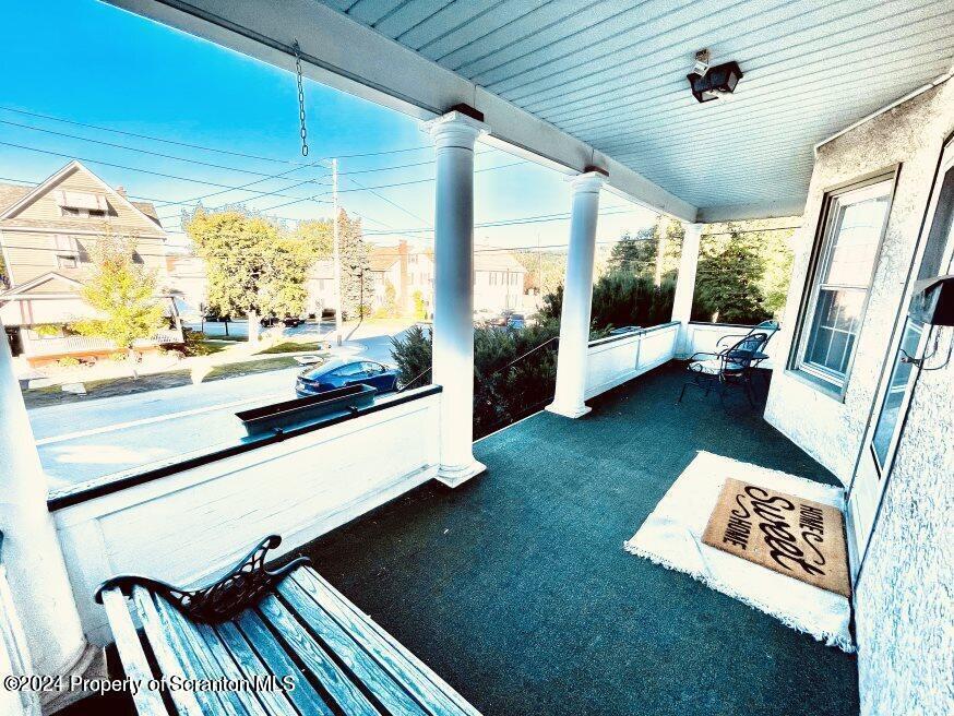 1630 Myrtle Street, Unit 2 Scranton, PA 18510 - Photo 1 of 17 a living room with rug floor to ceiling window and a table
