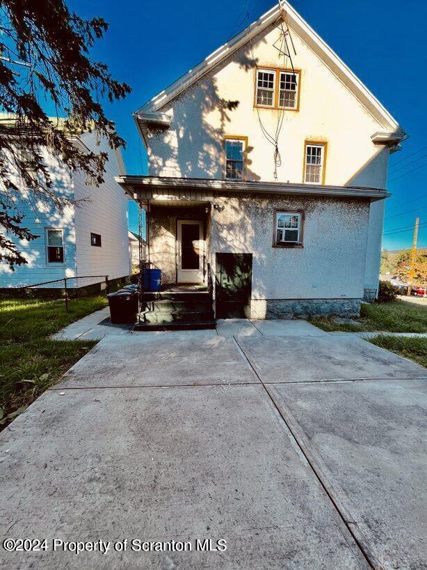 1630 Myrtle Street, Unit 2 Scranton, PA 18510 - Photo 16 of 17 a view of a white house with a large space and a yard